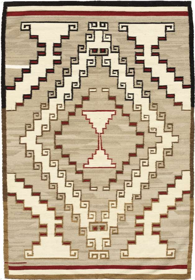 Classic Crystal Southwest wool flat-weave rug with beige, white, and red geometric Navajo patterns.