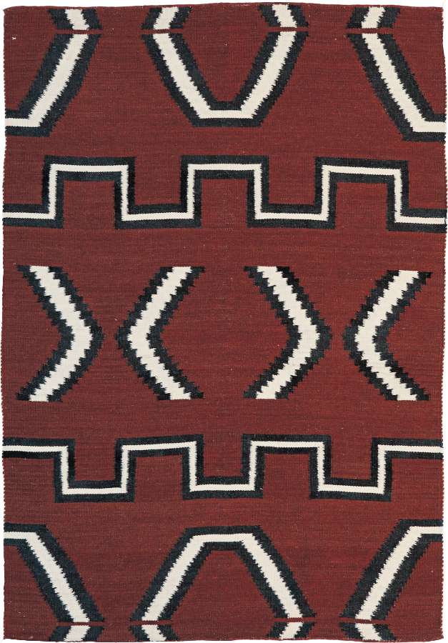 Serape Southwest flat-weave wool rug with red, black, and white Navajo geometric patterns.