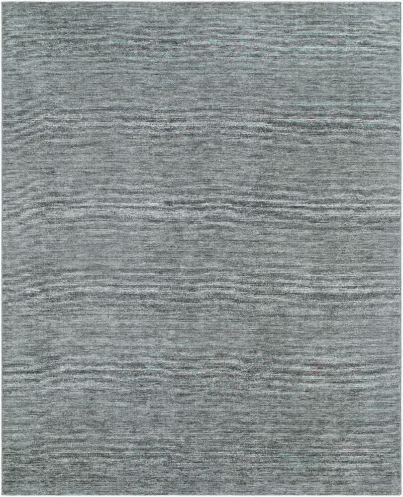 El Corte hand-loomed wool and cotton rug in a textured, solid grey color.