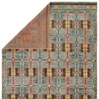 Hazan hand-knotted wool rug with a colorful geometric pattern in green, pink, blue, and brown.