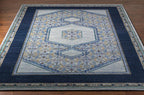 Haven Hand-Knotted wool rug with navy blue border and traditional grey and gold pattern