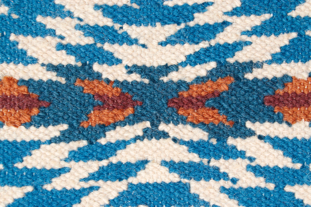 Pendleton Pagosa Springs flat-weave wool rug with blue, cream, and orange Southwest pattern.
