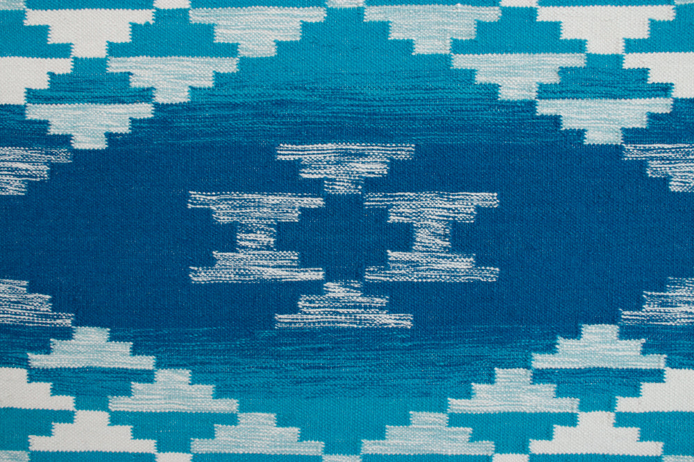 Pendleton Salt Creek turquoise and white wool flat-weave rug with Southwest geometric patterns.