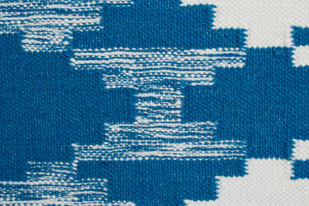 Pendleton Salt Creek turquoise and white wool flat-weave rug with Southwest geometric pattern.