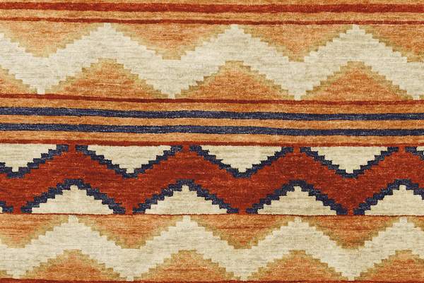 Pendleton Mesa hand-knotted wool rug with terra cotta, ivory, and blue Southwest geometric patterns.