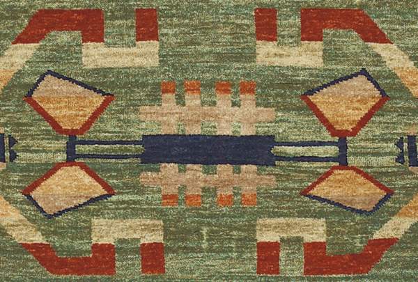 Pendleton Anasazi hand-knotted wool rug with Southwest geometric patterns in green, terra cotta, and beige.