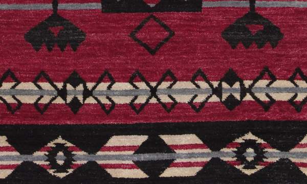 Pendleton Southwest wool rug in cardinal red, black, and gray geometric patterns.