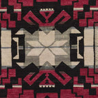 Pendleton Storm Cardinal Southwest hand-knotted wool rug with red, black, and ivory geometric patterns.