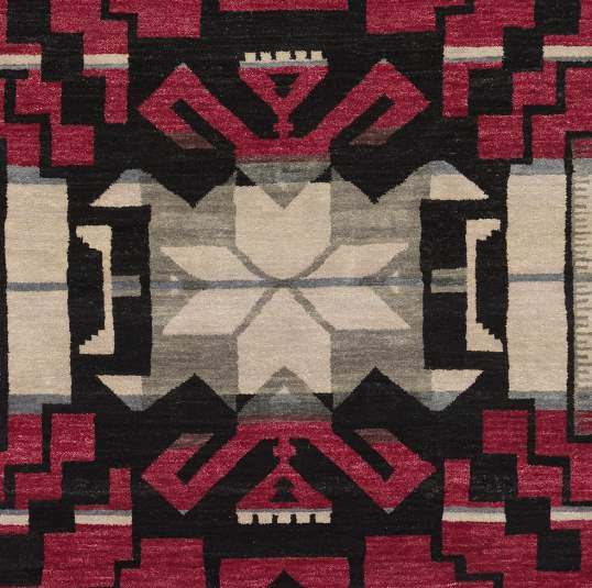 Pendleton Storm Cardinal Southwest hand-knotted wool rug with red, black, and ivory geometric patterns.
