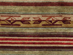 Pendleton Chimayo wool rug featuring hand-knotted Southwest patterns in red, brown, and gold.