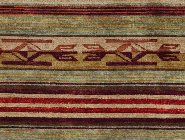 Pendleton Chimayo wool rug featuring hand-knotted Southwest patterns in red, brown, and gold.