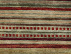 Pendleton Chimayo hand-knotted wool rug with red, green, and beige Southwest stripes.
