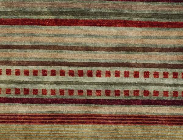 Pendleton Chimayo hand-knotted wool rug with red, green, and beige Southwest stripes.
