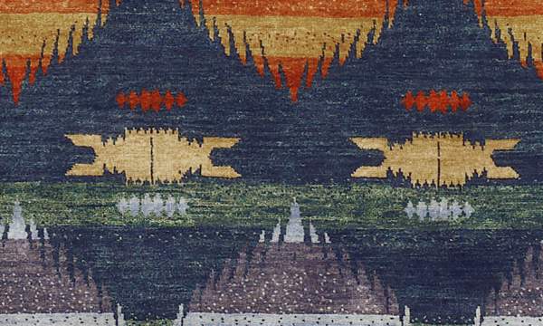 Pendleton Southwest wool rug with blue, terra cotta, and gold ombre patterns.