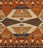 Pendleton TePee Southwest hand-knotted wool rug in burnt orange, brown, and tan geometric patterns.