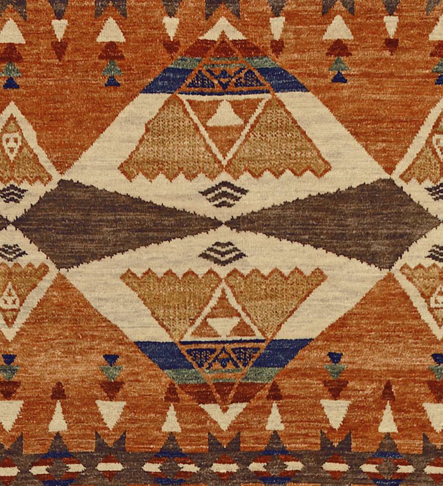 Pendleton TePee Southwest hand-knotted wool rug in burnt orange, brown, and tan geometric patterns.