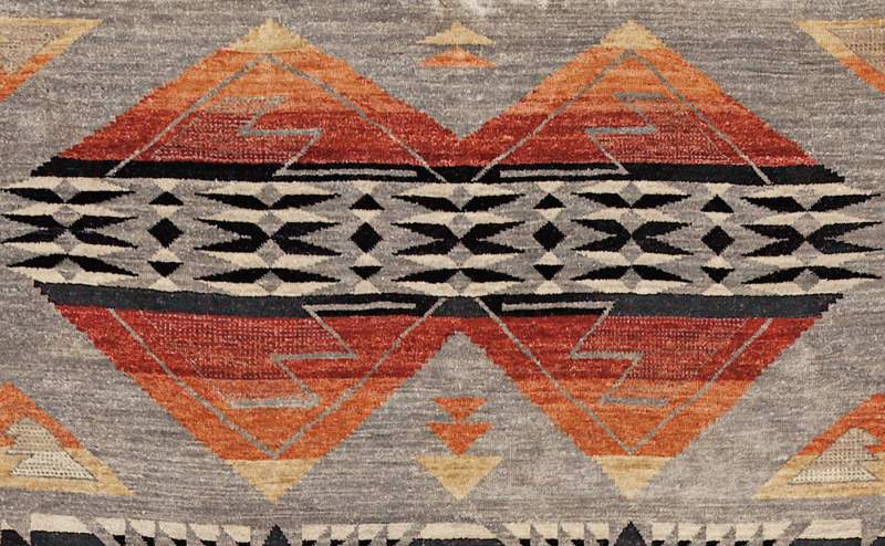 Pendleton Mt. Zion Southwest hand-knotted wool rug with gray, terra cotta, and black geometric patterns.