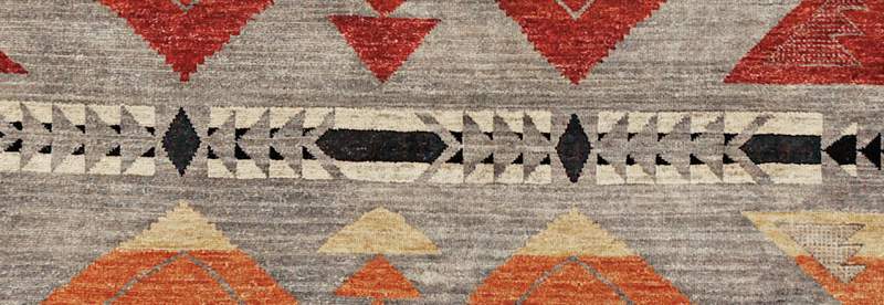 Pendleton Mt. Zion Southwest hand-knotted wool rug with gray, red, and orange geometric patterns.