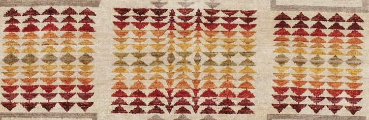Pendleton Harding Southwest hand-knotted wool rug with terra cotta, gold, and sage geometric patterns.
