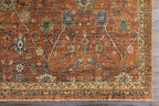 Reign hand-knotted wool rug in rust orange with traditional blue and green floral patterns.