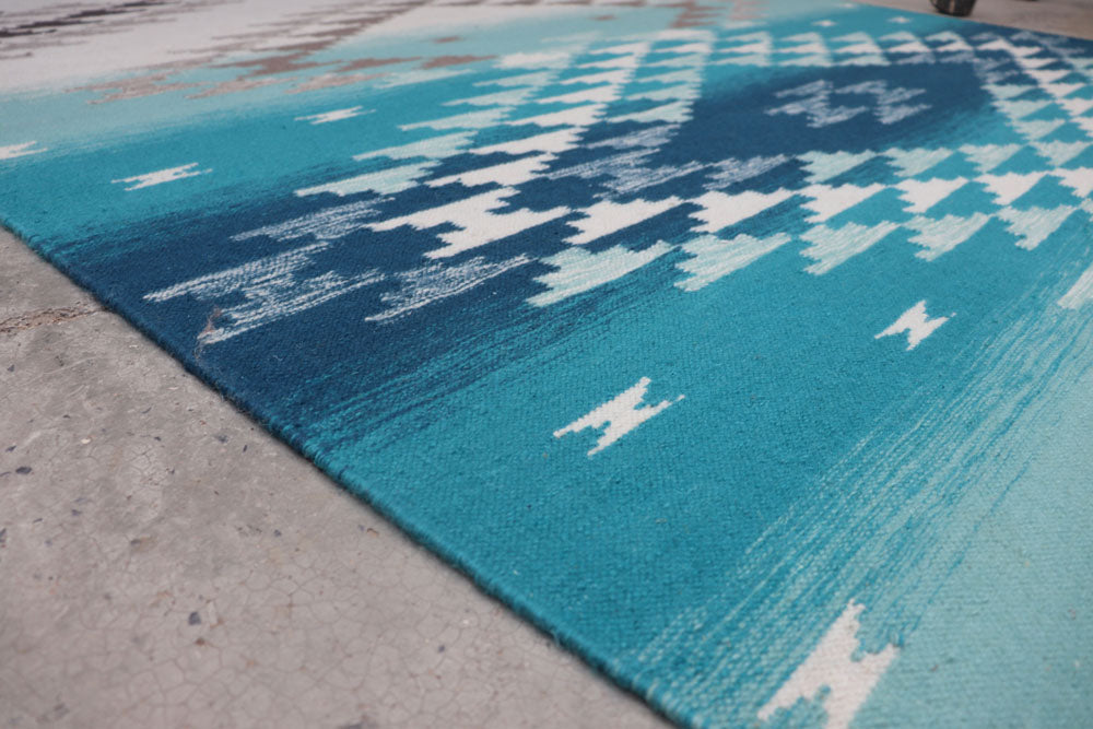 Pendleton Salt Creek turquoise and blue wool flat-weave rug with Southwest pattern.
