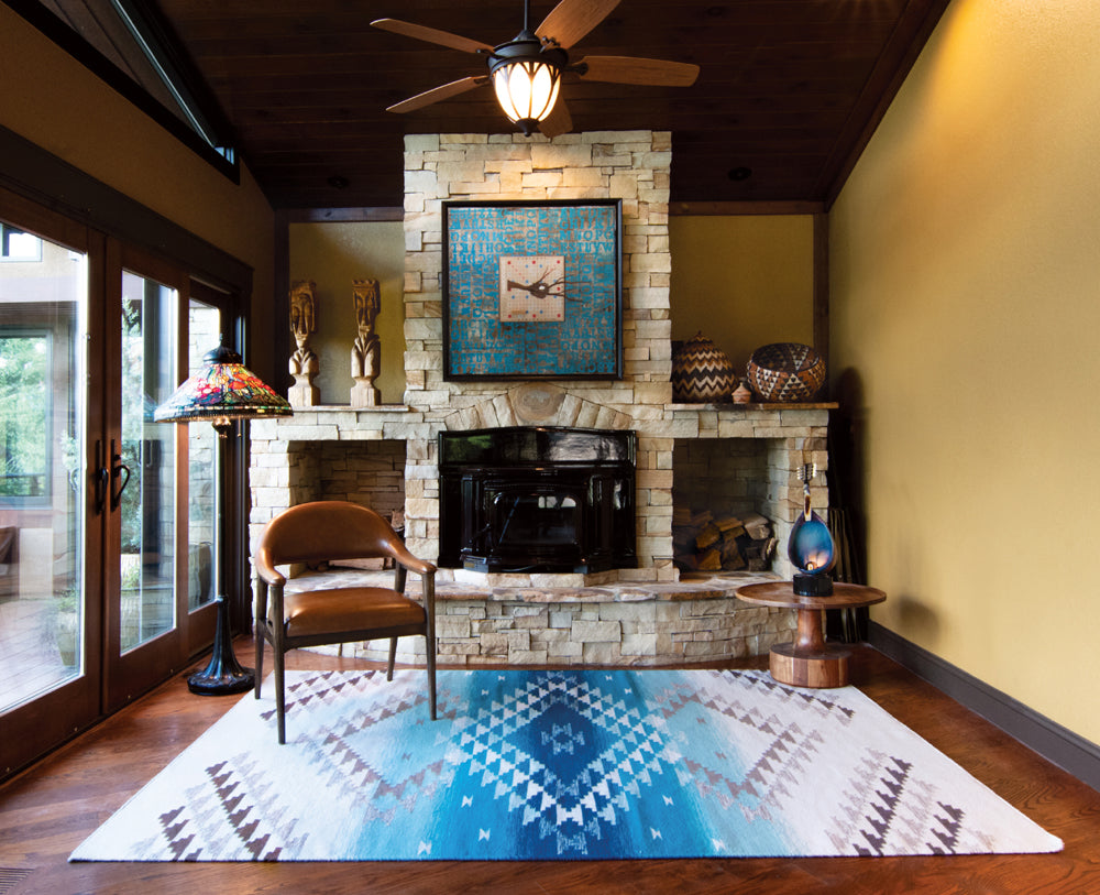 Pendleton Salt Creek turquoise Southwest wool flat-weave rug in a rustic living room.