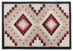 Los Lunas Southwest hand-knotted wool rug with geometric diamond patterns in beige, red, and black.