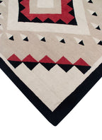 Los Lunas Southwest hand-knotted wool rug with red, black, and beige geometric patterns.