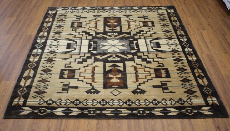 Pendleton Storm Falcon Southwest hand-knotted wool rug with geometric patterns on wood floor.