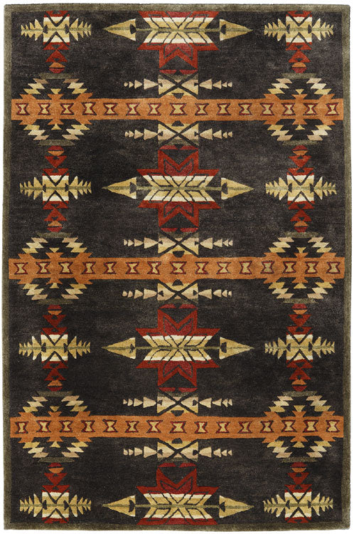 Pendleton Gatekeeper wool rug with Southwest patterns in charcoal, terra cotta, and gold.