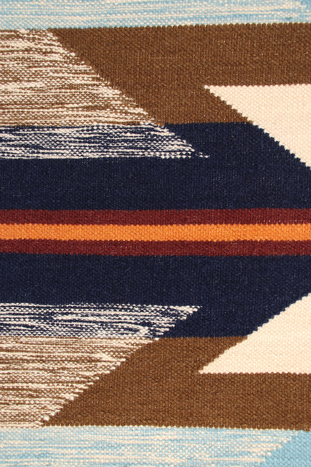 Pendleton Wyeth Trail wool rug with a Southwest arrow pattern in brown, navy, and orange.