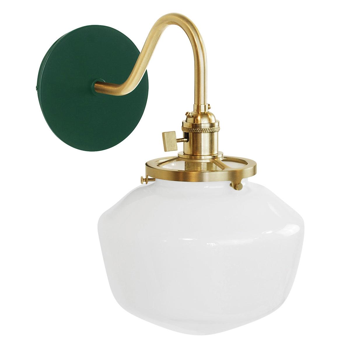Uno Schoolhouse Gooseneck Sconce with green backplate, brass arm, and white glass shade.
