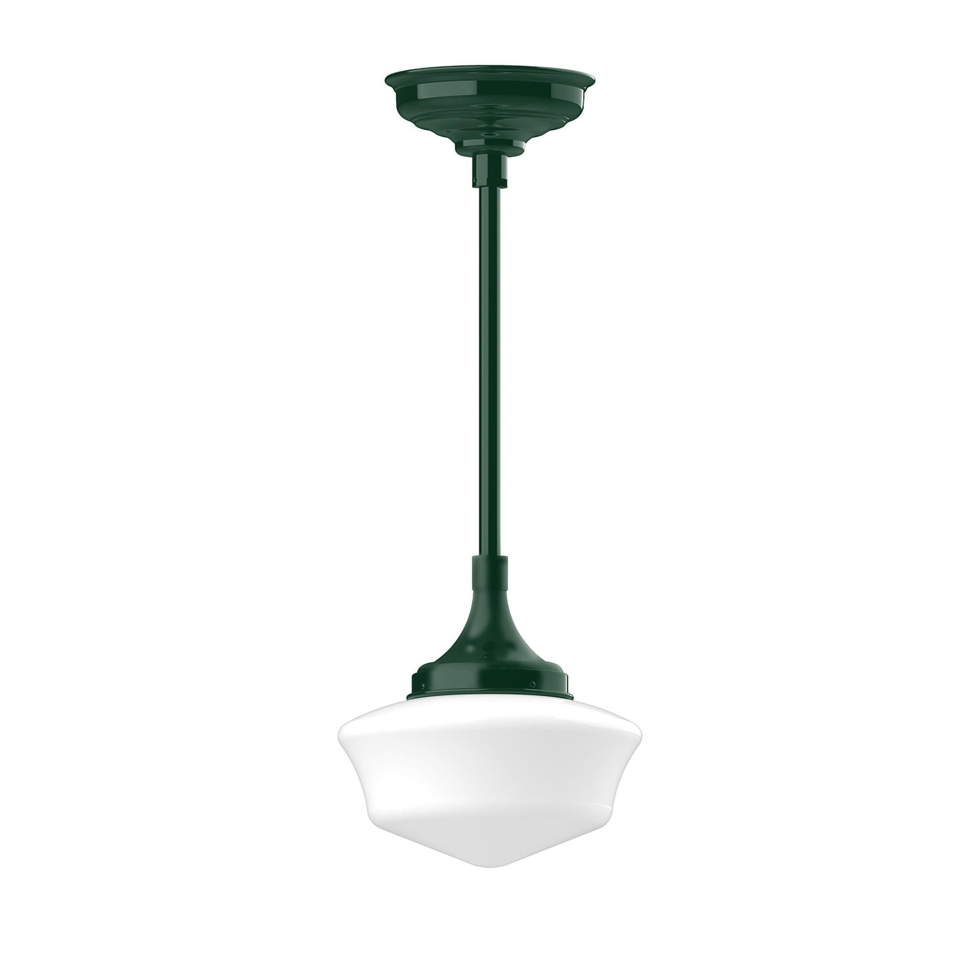 Schoolhouse stem hung pendant light with a dark green fixture and white glass shade.