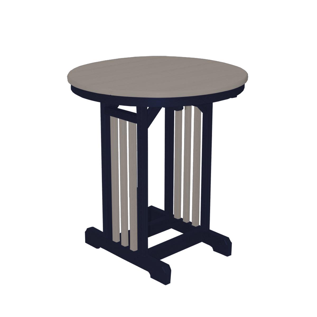 33-inch round outdoor table with a grey top and dark blue slatted base.
