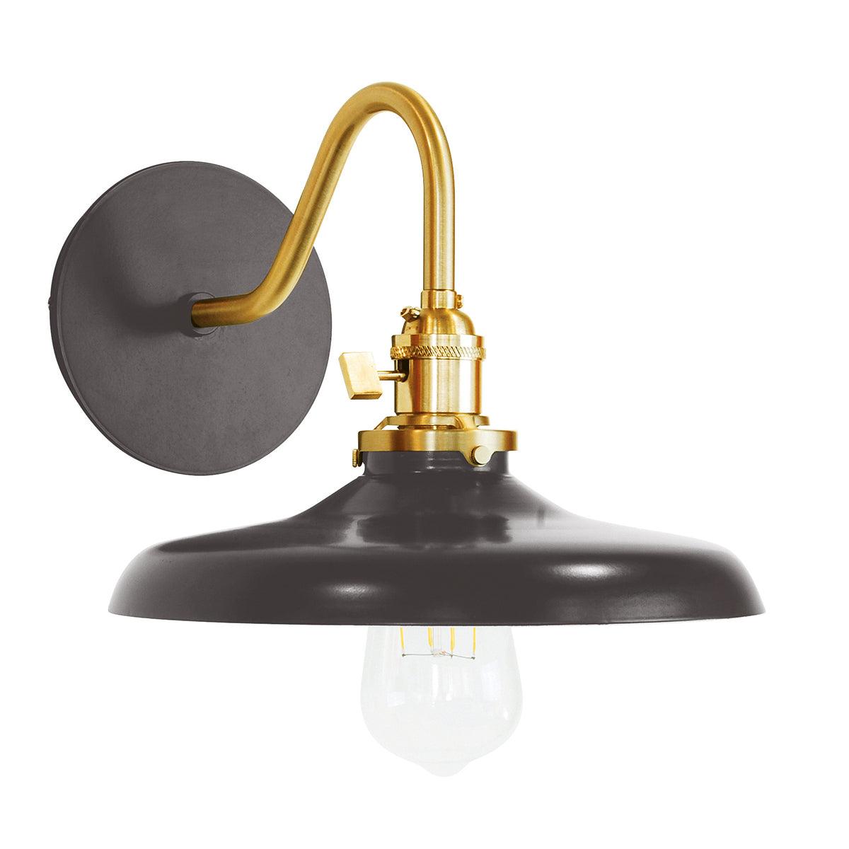 Uno Edison gooseneck arm sconce with a brass arm, black metal shade, and Edison bulb.