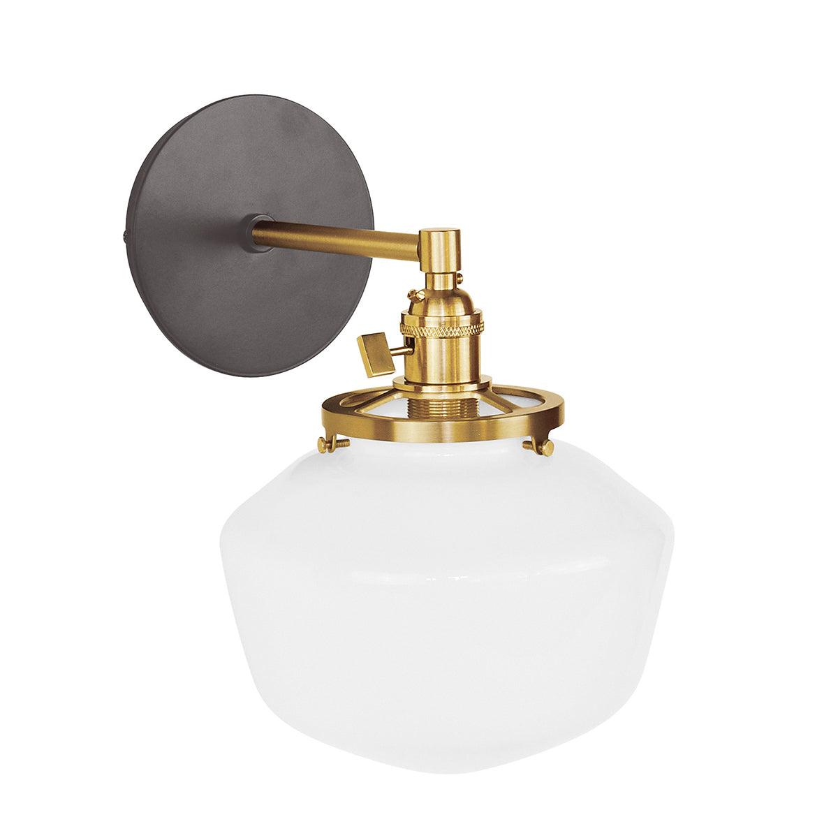 Uno schoolhouse straight arm sconce with black backplate, brass hardware, and white glass shade.