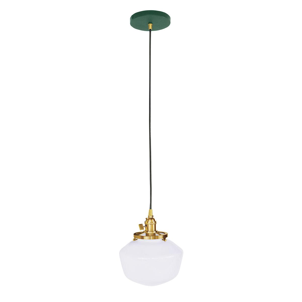 Uno Schoolhouse Pendant light with white glass shade, brass hardware, and a green canopy.