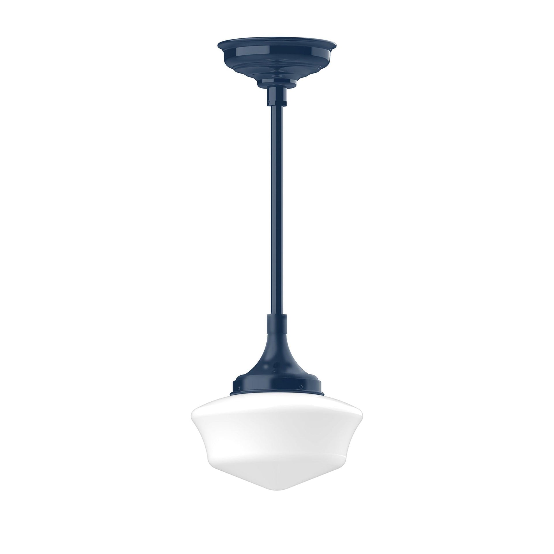 Schoolhouse stem hung pendant light with a navy blue fixture and white glass shade.