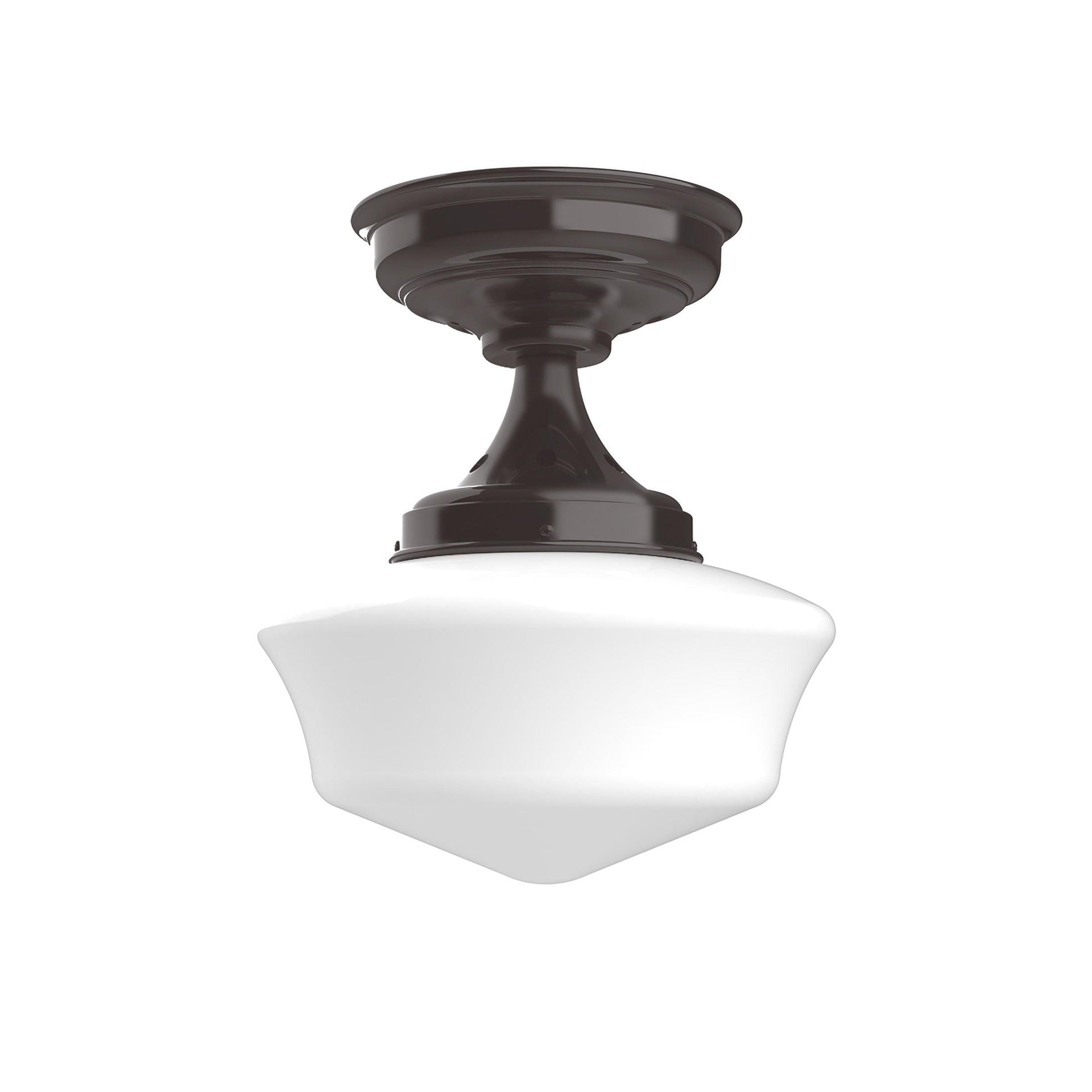Schoolhouse flush mount light fixture with dark bronze base and white milk glass shade.