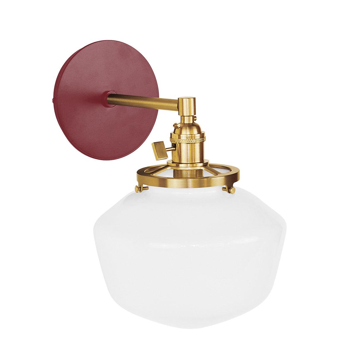 Uno Schoolhouse Straight Arm Sconce with red backplate, brass hardware, and white glass shade.