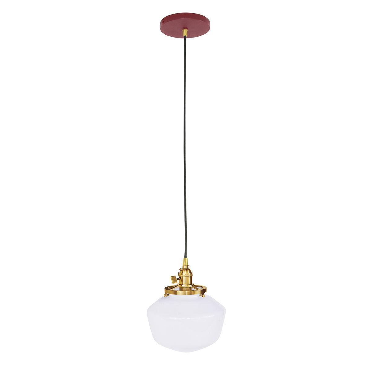 Uno Schoolhouse Pendant with white glass shade, brass hardware, and red canopy.