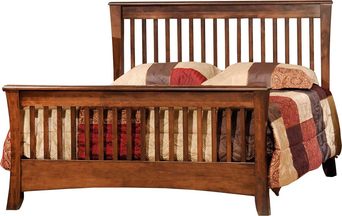 Carlisle convertible crib converted into a full-sized dark wood bed with a slatted headboard and footboard.