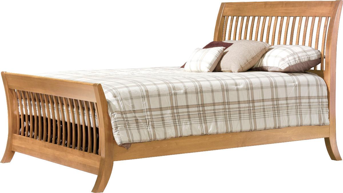 Manhattan convertible crib converted into a full-sized wooden bed with saber legs