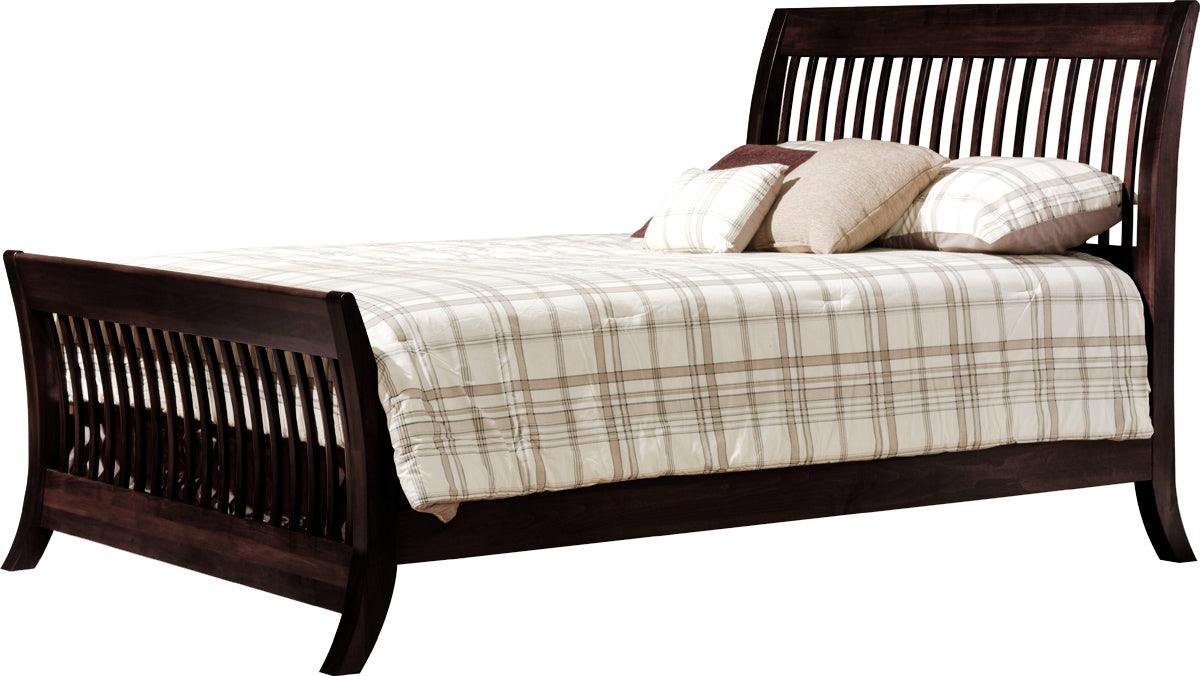 Manhattan convertible crib converted into a dark wood full-sized bed with plaid bedding