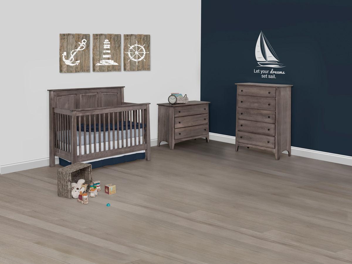Gray solid maple Shaker convertible crib with matching dressers in a nautical-themed nursery.