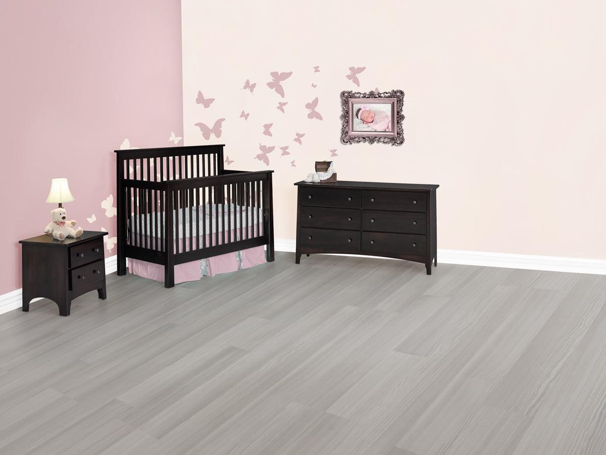 Dark brown Shaker convertible crib and matching dresser in a pink nursery with butterfly wall decals.