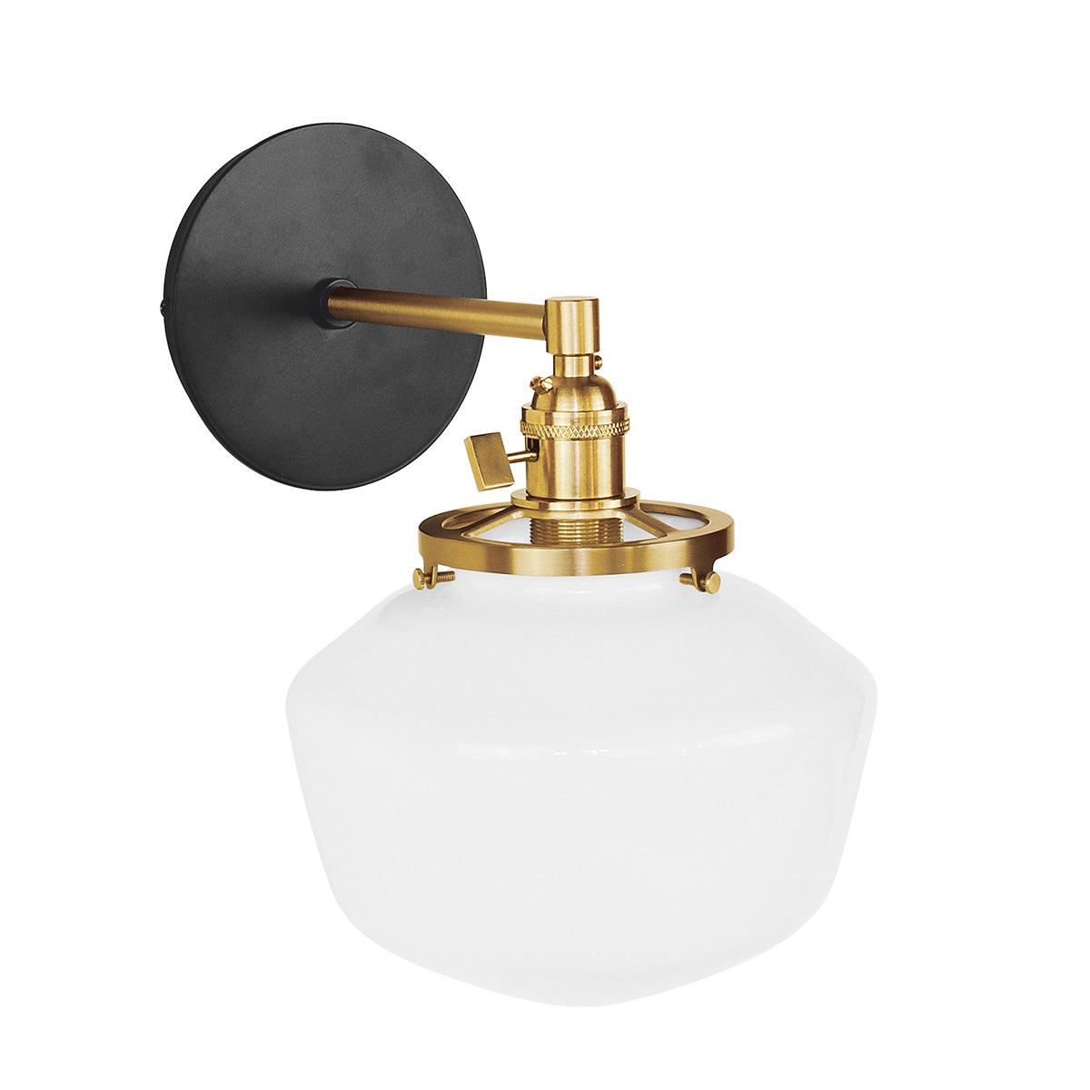 Uno Schoolhouse Straight Arm Sconce with black backplate, brass hardware, and white glass shade.